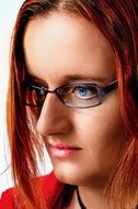 portrait of a girl in glasses with red hair