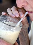 woman drinking milkshake