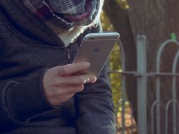 man watching iPhone