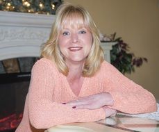 attractive caucasian adult Woman posing at table indoor