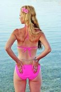 Blonde Womanin in pink swimsuit