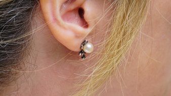 pearl Earring in Woman’s ear