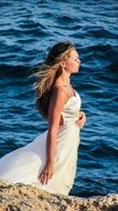 woman in romantic dress on the beach