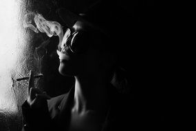 smoking woman in glasses, dark portrait