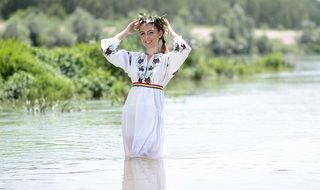 girl in a white dress with embroidery