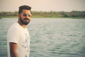 Man with the beard near the water