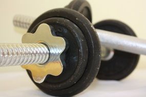two metal fitness dumbbells