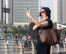 woman takes selfie on mobile phone