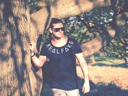 the guy near the tree
