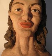 sculpture of a woman with red lips