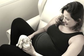 pregnant woman with soft toy