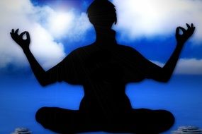 silhouette of a man in a yoga pose