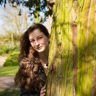 Girl by the tree