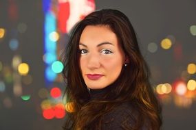 young woman over night city background