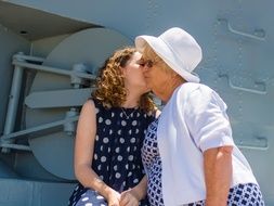 photo granddaughter kisses grandmother