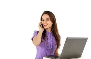 Smiling girl with laptop and cellphone