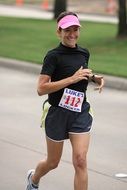 runner in black tracksuit at competitions