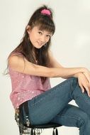 Asian young Woman posing on a chair