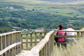 man and woman on the observation deck