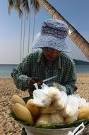 fruit saleswoman on the beach