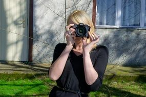 Blond woman makes photo