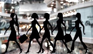 black silhouettes of female figures on the background of the store