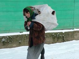 poor gipsy woman in winter, transcarpathia