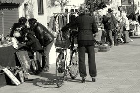 Woman with Bicycle on Flea market, italy, venice