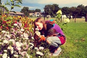 young girl enjoying Flowers on Farm at autumn