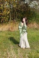 girl in a white dress on a background of beautiful nature