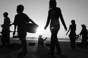 Black And White picture of the people on a beach