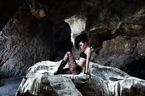 gothic girl posing on the stone