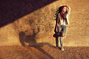 woman and shadow on the wall