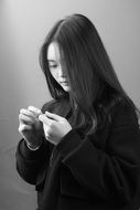 black and white image of a pensive girl