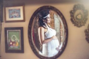 pregnant woman in the mirror