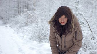 woman in the snowy forest in winter