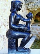 bronze statue of a mother with child