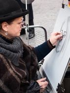 street Painter, woman Drawing portrait outdoor
