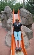 woman on a hill at a playground in the Caucasus