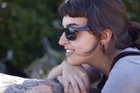 Young Woman in dark Glasses outdoor, portrait