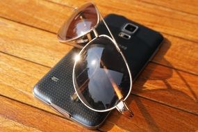 sunglasses and smartphone