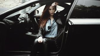 stylish girl in a beautiful car