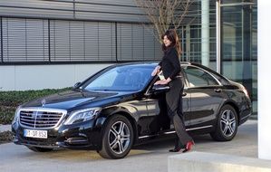 girl near the black car