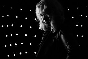 blonde Woman in front of Spotlights, black and white