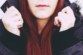 girl in a winter jacket with long brown hair