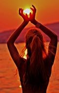 silhouette of a beautiful woman at sunset