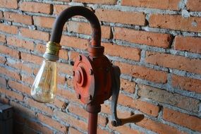 old lamp near the brick wall