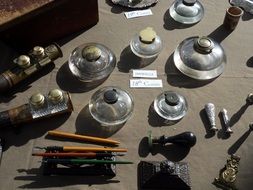 inkwells and feathers on the table