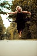 girl jumping on the road