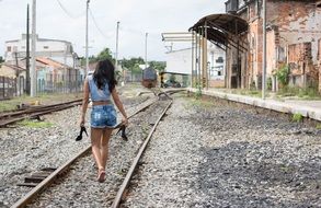 Walking girl on rail station